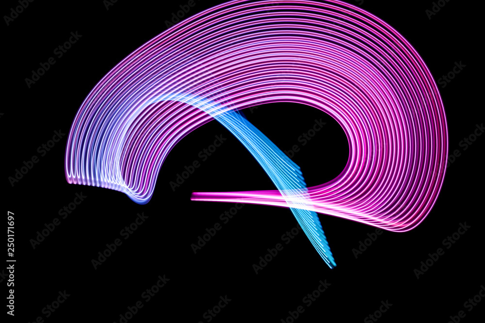 Aufkleber abstract rainbow neon glowing crossing lines pattern. dark  background of colorful neon glowing ligh
