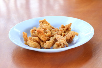 skin of grilled chicken on plate