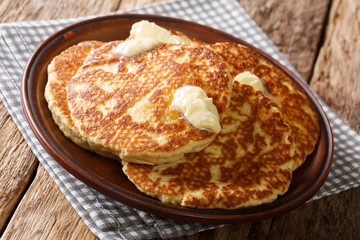 Homemade Gorditas de Azucar Sweet Griddle Cakes with butter close-up on a plate. horizontal