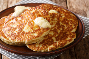 Mexican pancakes Gorditas de Azucar with butter close-up on the table. horizontal