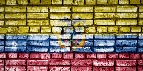 National flag of Ecuador on a brick background. Concept image for Ecuador: language , people and culture.