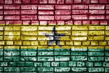 National flag of Ghana on a brick background. Concept image for Ghana: language , people and culture.