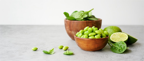 Edamame beans in bowl on light background. Close up view