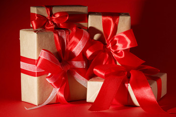 Wrapped presents with bright red background with copy space