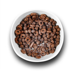 Chocolate cornflakes with milk. Close up. Top view. Isolated on white background