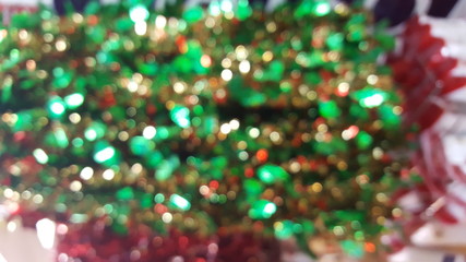 Blurred background of the Christmas tree with a bokeh light.