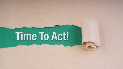 TIME TO ACT text on brown envelope and torn paper. Concept Image