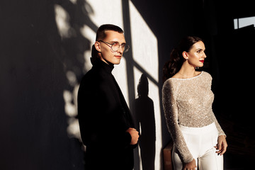 Beautiful young couple in classic suits