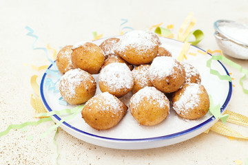 Frittelle - italian fritters in Carnival on white plate .