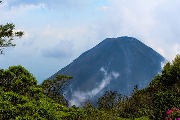 Fototapeta na wymiar Volcano in clouds
