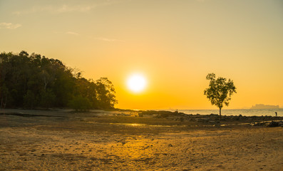 sunset at Kwang island. Kwang island is in the middle of Kwang beach Krabi Thailand.when low tide can walk to Kwang island