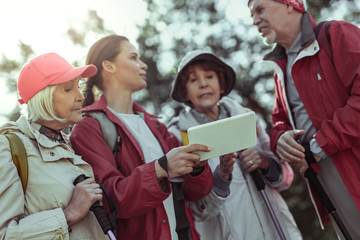 Tablet is being used by tourists in mountains