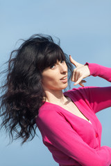 Portrait of young brunette woman outdoors