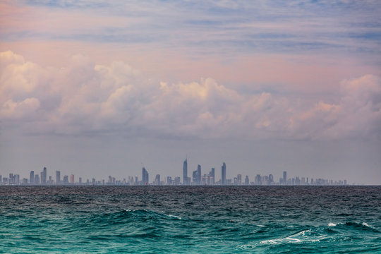 Gold Coast city skyscrapers skyline across the ocean on summer day