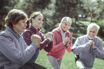 Taut sportive pensioners watching on their trainer