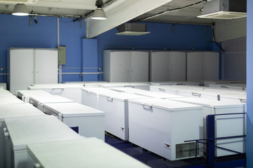 Fototapeta na wymiar Warehouse with white refrigerators