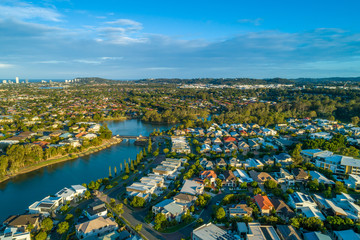 Aerial landscape of Varsity Lakes suburb and Reedy Creek at sunset. Gold Coast, Queensland, Australia