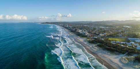 Aerial panorama of Palm Beach suburb and ocean coastline at sunset. Gold Coast, Queensland, Australia