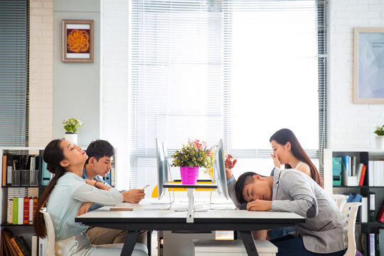 Business young men and women to work overtime