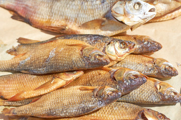 A few dried fish in the bright sun, close-up
