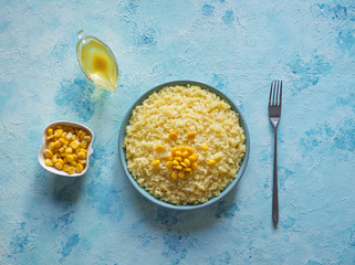 Organic corn porridge in the plate. Top view.
