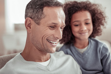 Fototapeta premium Smiling handsome father spending a day with his daughter