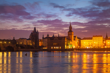 Obraz premium View of night Prague. Charles Bridge, towers and castle in Prague, Czech Republic