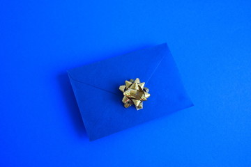 Directly above shot of blue envelope on blue background