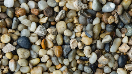 Abstract pebble stones background texture macro, selective focus