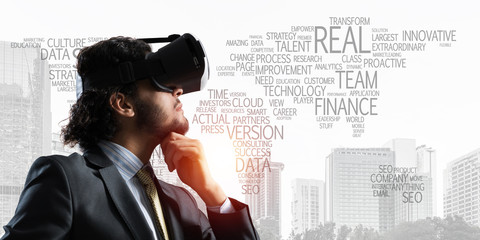 Handsome elegant businessman experiencing impressive virtual reality and business city at backdrop