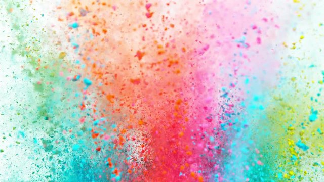 Super slowmotion shot of color powder explosion isolated on white background.