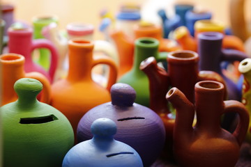 terracotta made ceramic, colored piggy bank and jugs