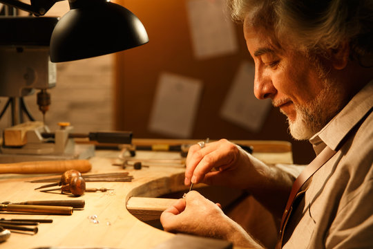 Goldsmith working in workshop