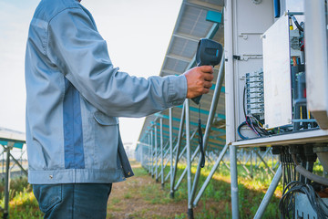 engineer or electrician inspect and checking solar equipment