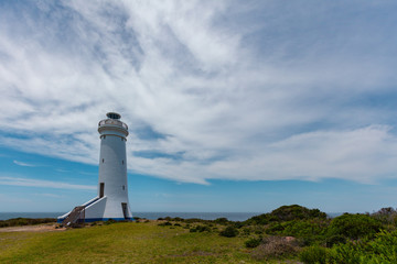 Fototapeta na wymiar Point Stephens Lighthouse powered by solar panels on bright summer day. Fingal Bay, New South Wales, Australia