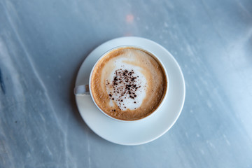 Top view of coffee cup on table