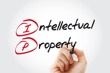 Hand writing IP - Intellectual Property with marker, acronym business concept
