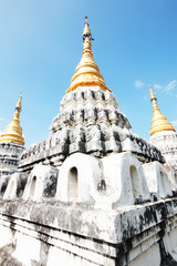 Golden pagoda at Wat Prathat Lampang Luang temple located in Lampang Province, Thailand.