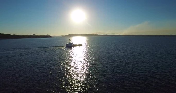Aerial view with drone of a well sailing through the bosom of Reloncavi at sunset