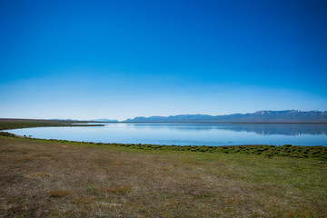 Tranquil lake Sonkul with blue sky.