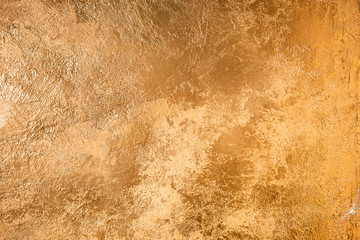 Abstract Gold Texture. Wall Colored With Golden Plaster.