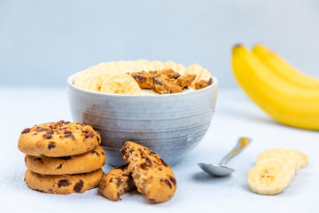cream dessert with fruit in a bowl on blue background