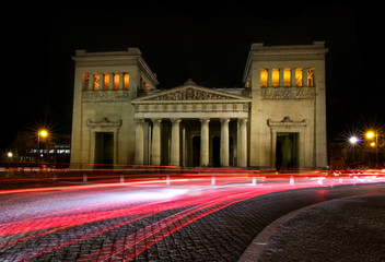 munich city at night with red traffic car lights time exposure at kings place