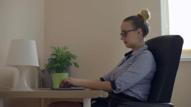 Beautiful woman suffering from neck pain in home