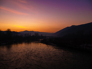 Naklejka premium Beautiful landscape stones in mountain lake, reflection, blue sky and yellow sunlight in sunrise. Ukraine. Amazing scene