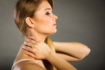 Woman suffering from neck pain