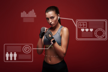 New champion. Young sportswoman standing over red background is ready to exercise. Game concept...