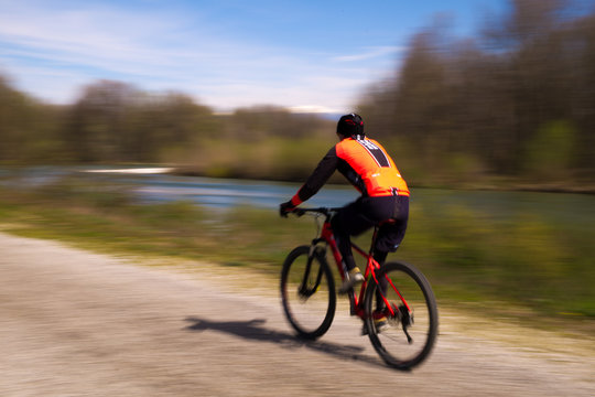 Panning Photo of a Cyclist. Brenta River, Piazzola sul Brenta, Padova, Italy. 9th August 2019