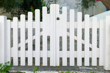 Front view of white wooden gates