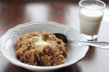 A plate of traditional Finnish talkkuna porridge and a glass of milk
